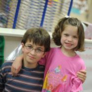 Two children smiling at school