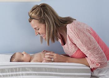 Woman smiling at baby