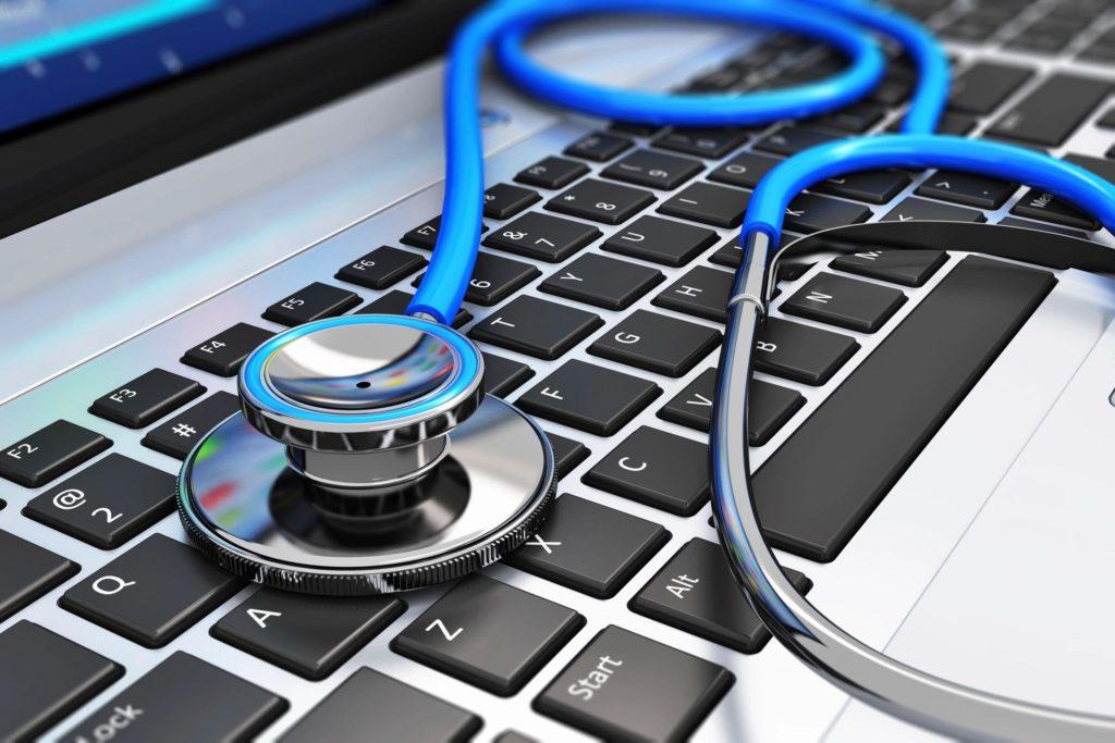 Stethoscope sitting on laptop keyboard