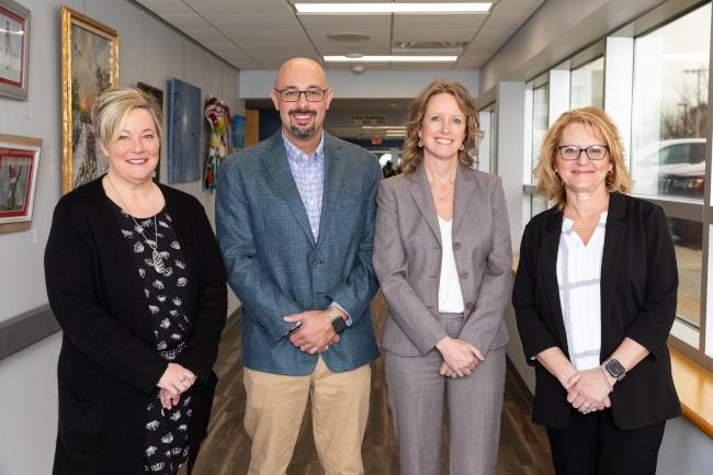 Four members of Magruder Hospital Leadership standing together
